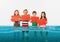 Group of children with blank red banners standing in water of melting glacier, global warming