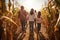 Group of children exploring corn maze in the fall day. Friends playing in corn maze. Kids on pathway in corn field. Popular