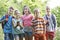 Group Of Children Geocaching In Woods