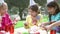 Group Of Children Having Outdoor Birthday Party