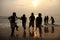 Group of children play on the beach