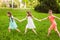 Group of children play on the green grass