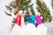 Group of children play snowballs game in forest