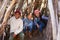 Group Of Children Playing In Forest Camp Together