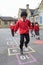 Group Of Children Playing Hopscotch In School Playground