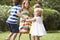 Group Of Children Playing Outdoors Together