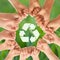 Group of children putting hands together and recycling symbol against blurred background