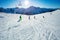 Group of children in ski school on mountain slope