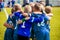 Group Of Children In Soccer Team. School Football Coachâ€™s Pregame Speech