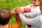 group of children stacking hands at park