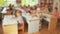 A group of children at the tables in the Russian kindergarten. Development of the child before the school. Blurred view.