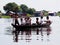 Group of Children Traveling by Boat in Floating Village