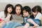 Group of children using tablet in classroom, Multi-ethnic young boys and girls happy using technology for study and play games at