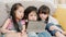 Group of children using tablet in classroom, Multi-ethnic young boys and girls happy using technology for study and play games at