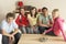 Group Of Children Watching TV At Home