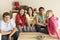 Group Of Children Watching TV At Home