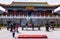 Group of Chinese people in front of the Tianmenshan temple on top of Tianmen Mountain