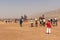 Group of Chinese tourists taking pictures near the Flaming Mountains, Xinjiang