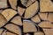 Group chopped logs pile of firewood background rustic close-up design cracked light beige