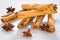 Group of cinnamon sticks with star anice on a white and lucid backround