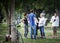 a group of citizens in the Park, talking friends