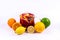 Group of citric fruits with a lemonade carafe on a white background