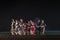 A group of Classical Odissi dancers perform Odissi Dance on stage at Konark Temple, Odisha, India.