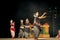 Group of Classical Odissi dancers performing Odissi Dance on stage at Konark Temple, Odisha, India.