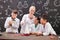 Group of clever students of secondary school during chemical experiment