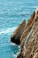 Group of cliff divers in free fly, Acapulco, Mexico.