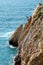 Group of cliff divers in free fly, Acapulco, Mexico.