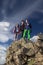 Group of climbers stays on the pointed cliff