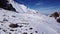 A group of climbers is walking in the mountains.