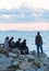 Group of close young friends watching the sunset in White Rock  British Columbia