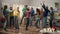 A group of colleagues in festive hats and glasses are dancing, having fun, celebrating a common success, a birthday