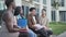 a group of college students talk on the campus of the university during a break