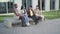 a group of college students talk on the campus of the university during a break