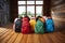 Group of colorful backpacks on the wooden floor near the window, Colourful children schoolbags on wooden floor. Backpacks with