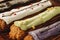 Group of colorful eclair cakes close up