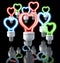Group of colorful fluorescent lamps, heart shaped, red, blue, green glow, 3d rendering on dark background