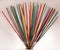 Group of colorful incense sticks on clay support