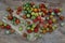 Group of Colorful variety of Fresh wild tomatoes Mini Cherry Tomatos on old wooden board background