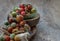 Group of Colorful variety of Fresh wild tomatoes Mini Cherry Tomatos on old wooden board background