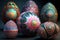 a group of colorfully painted eggs sitting on top of each other
