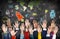 Group of Colourful Hands Raised with Symbols