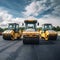 Group of compactors and heavy rollers at asphalt pavement works