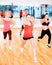 Group of concentrated people exercising in the gym