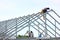 group of construction worker welding new house roof beams