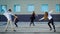 Group of contemporary dancers freestyling outside in summertime.