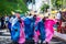 Group of costumed people run during the Fuzue parade